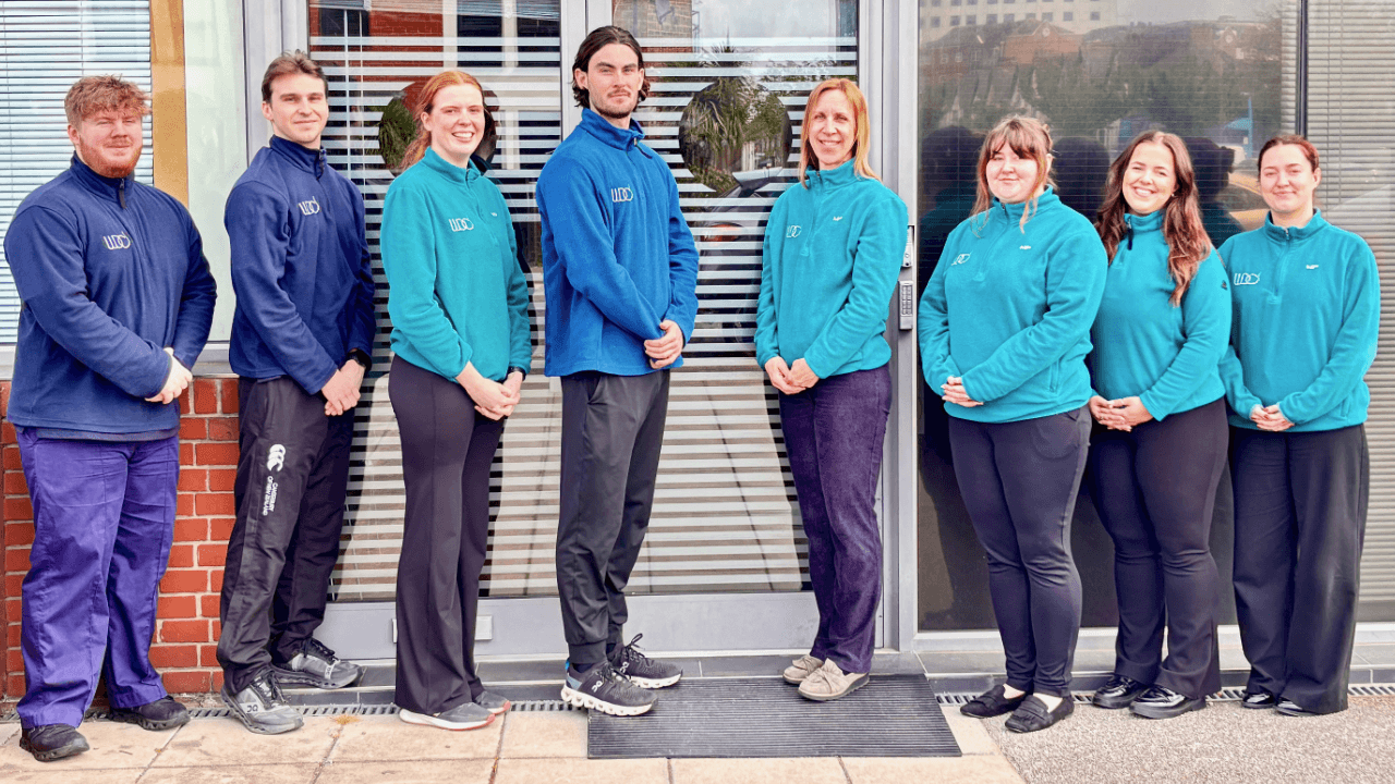 The WDC Physio team standing in a line outside the clinic